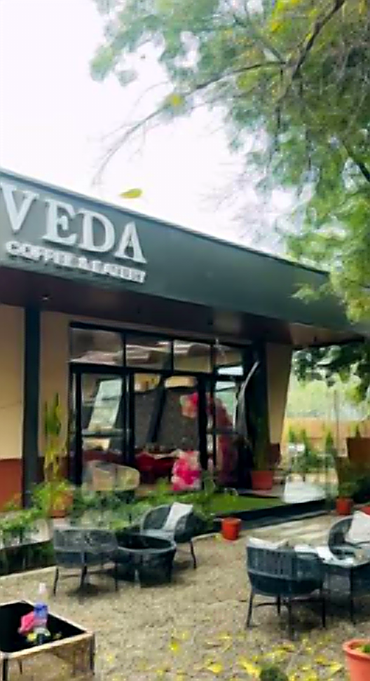VEDA Cafe storefront in the evening